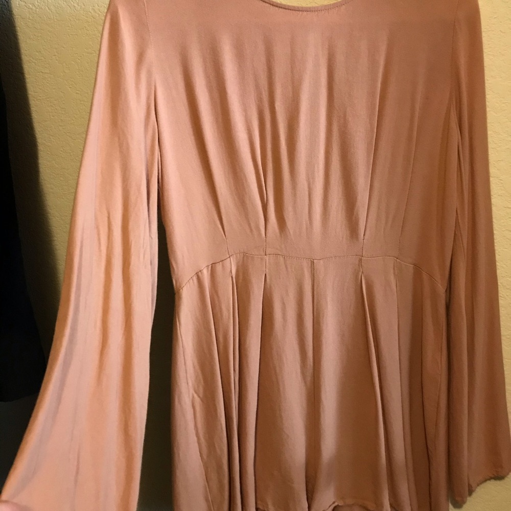Beautiful long sleeve, short romper w/ open back
